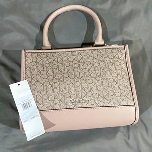 Selling A Calvin Klein purse. The color is a soft pink.